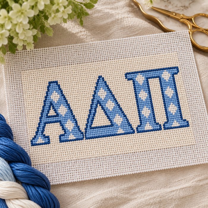 Alpha Delta Pi needlepoint canvas featuring ΑΔΠ letters over azure blue and white stripes